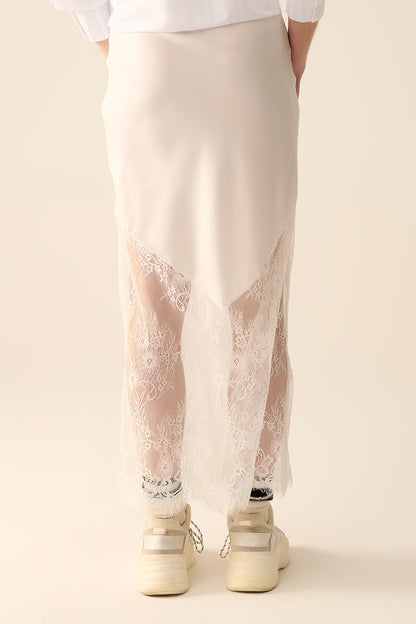 white satin skirt with lace at the bottom