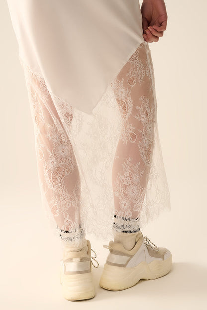 white satin skirt with lace at the bottom