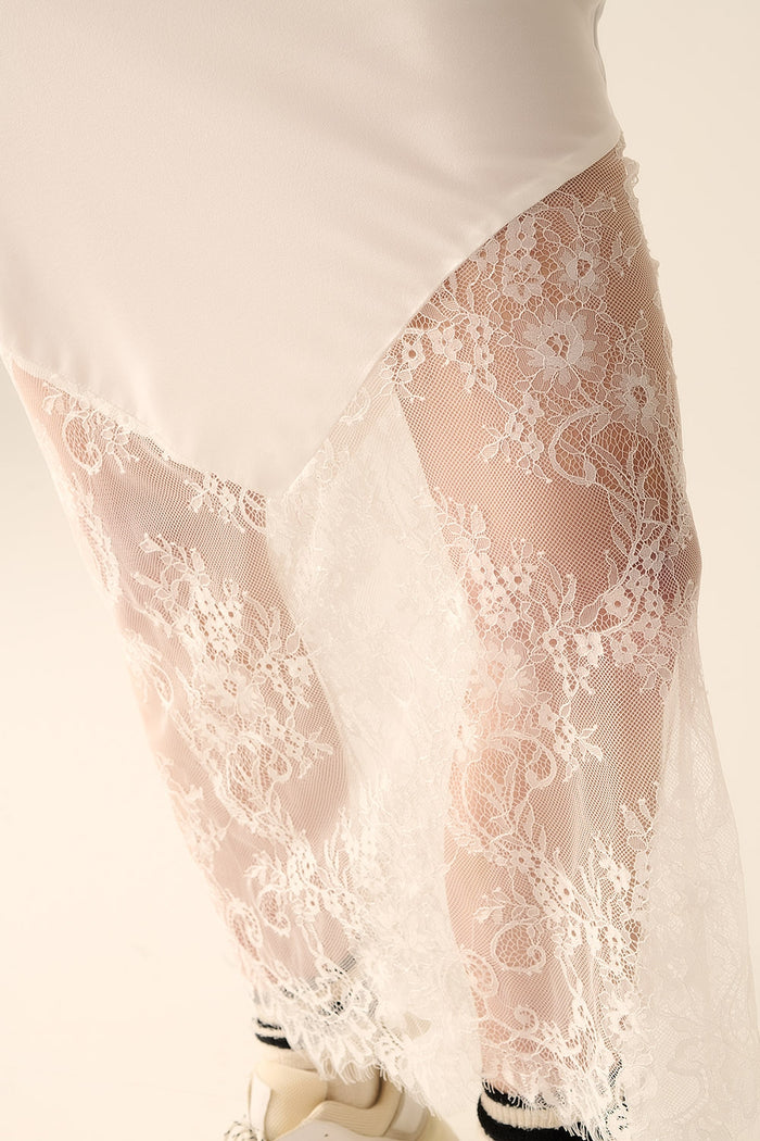 white satin skirt with lace at the bottom