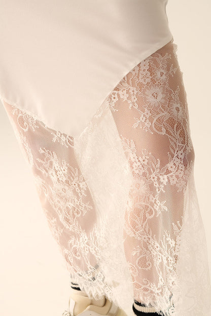 white satin skirt with lace at the bottom