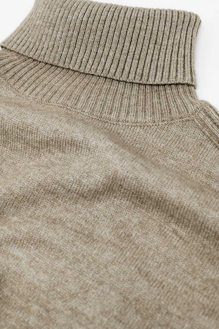 wide beige sweater with ribbed sleeves