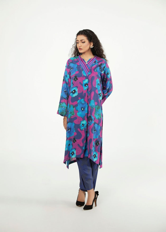 Women’s tunic and pants set with bold blue and purple floral print, 3/4 sleeves