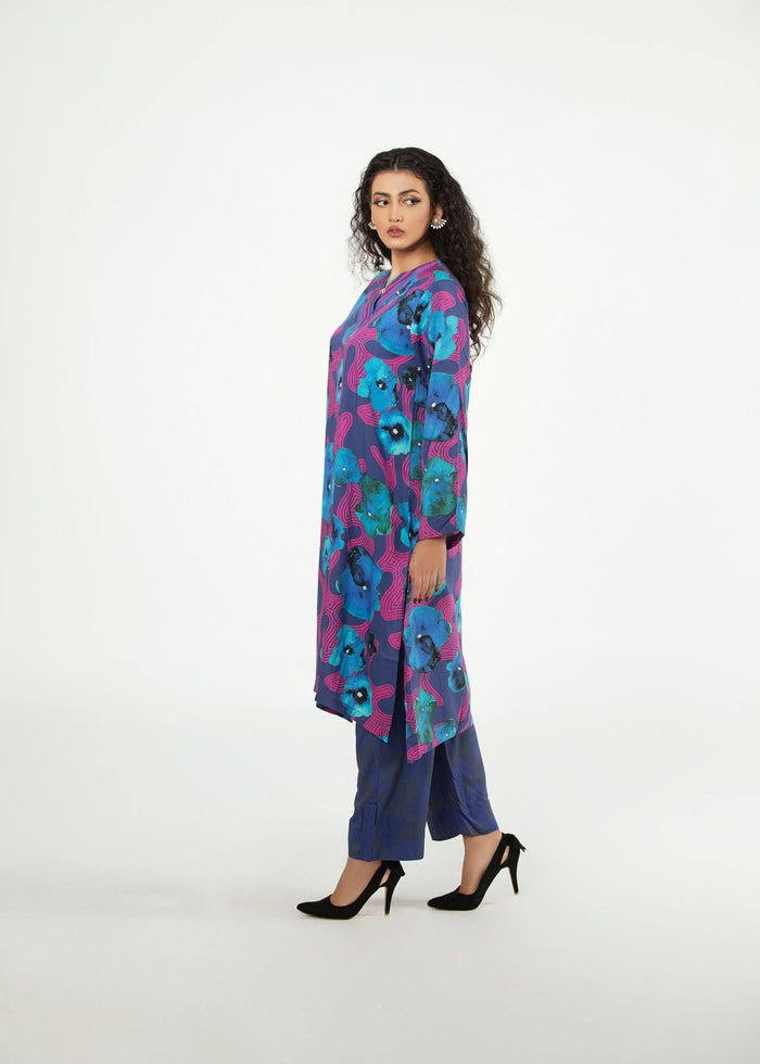 Women’s long tunic and pants set with blue and purple floral print, side view