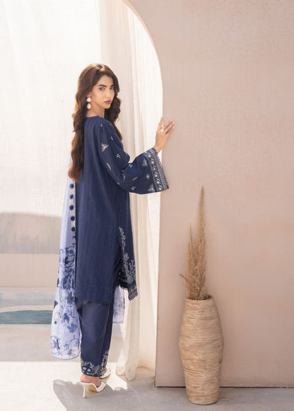 Women's dark blue embroidered tunic and pants with sheer light blue floral dupatta