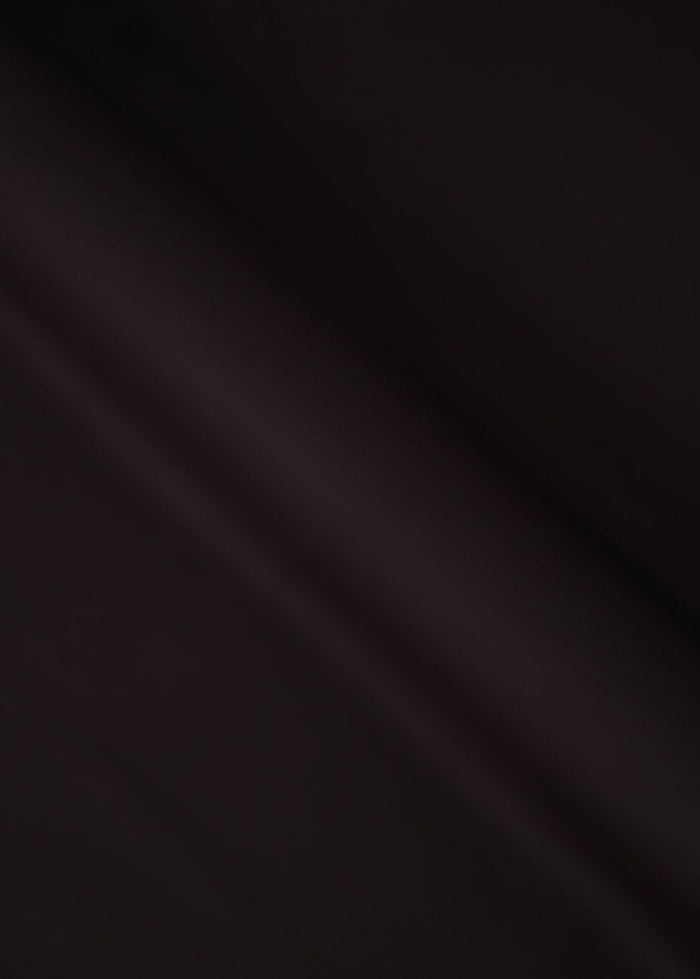 Chocolate-brown dobby fabric texture, soft drape close-up
