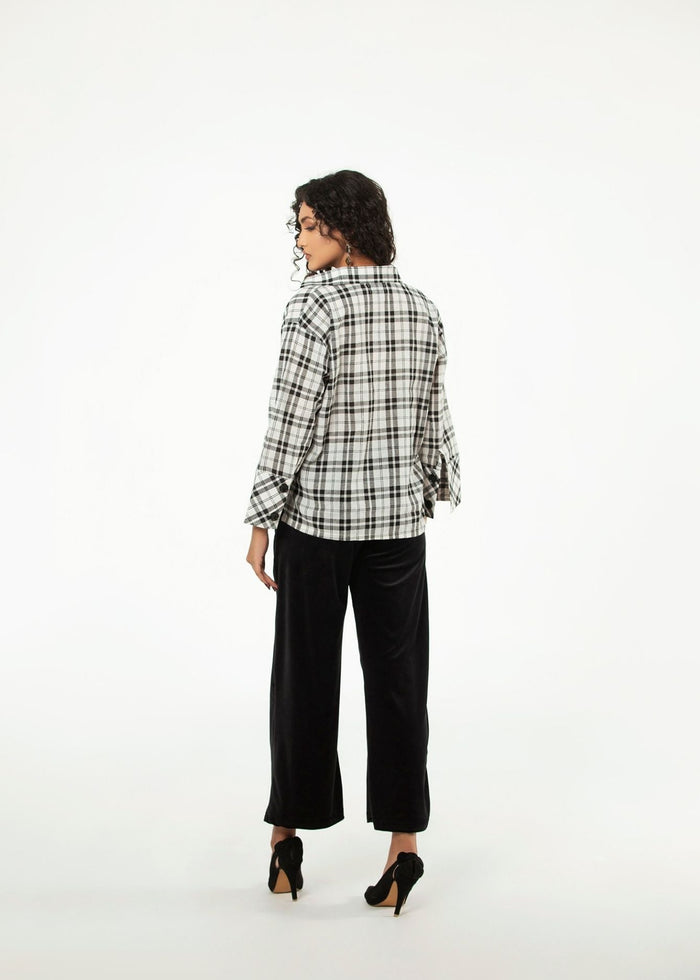 Women's black-and-white check long-sleeve top, back view
