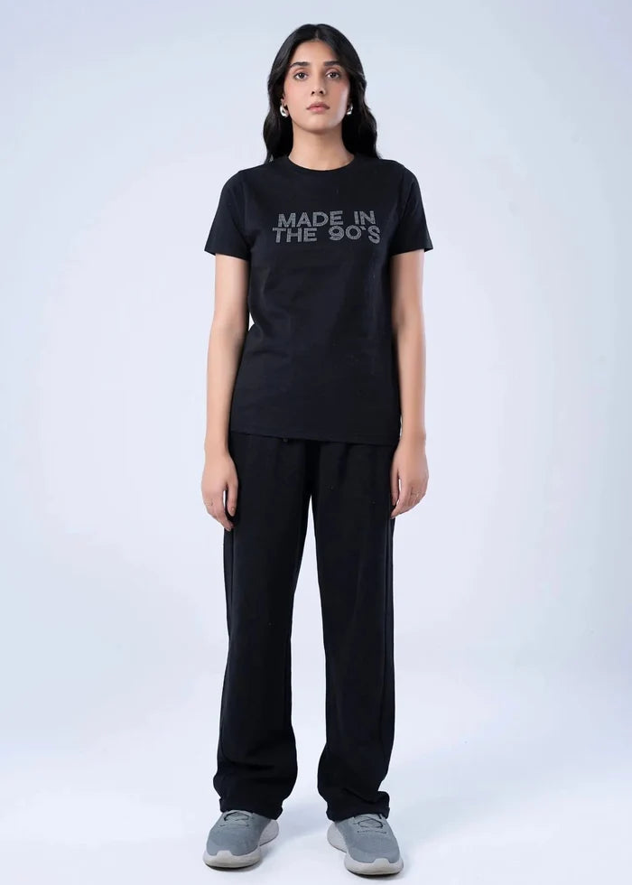 Women's black short-sleeve top with crew neck; 'MADE IN THE 90s' on front