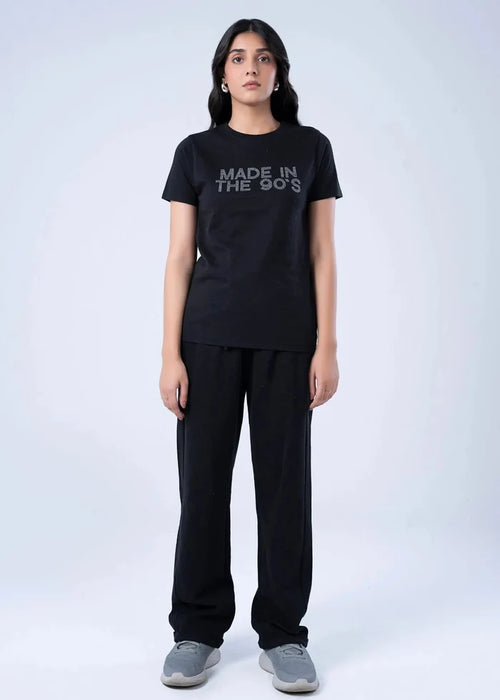 Women's black short-sleeve top with crew neck; 'MADE IN THE 90s' on front
