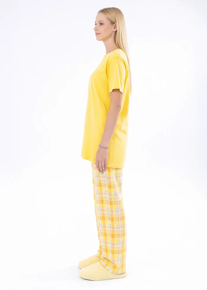 Yellow short-sleeve night shirt and plaid pajama trousers, side view