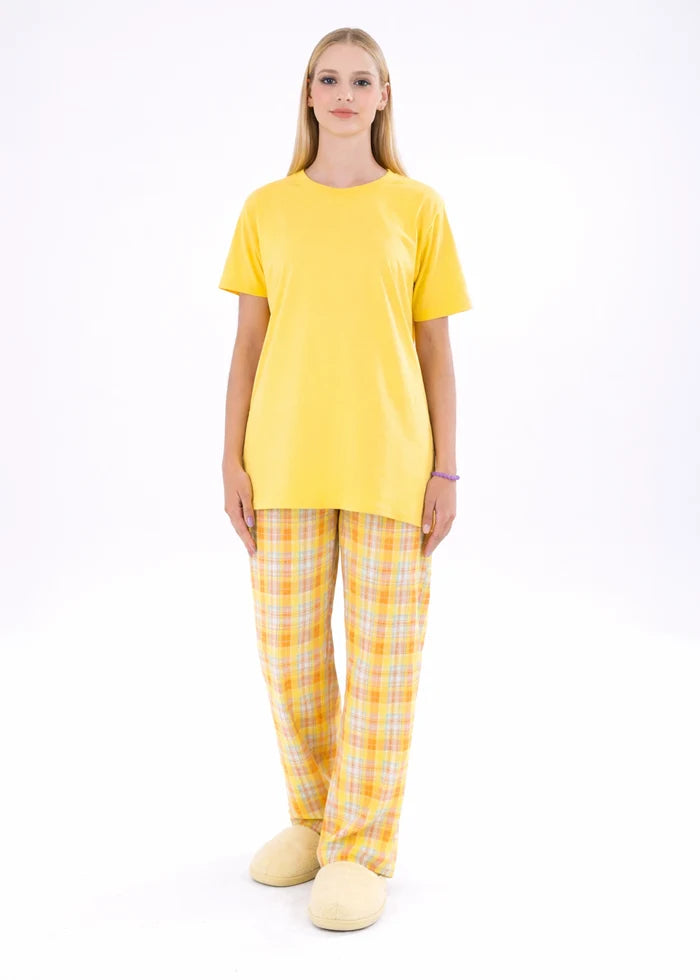 Yellow night shirt with crew neck and plaid pajama trousers, front view