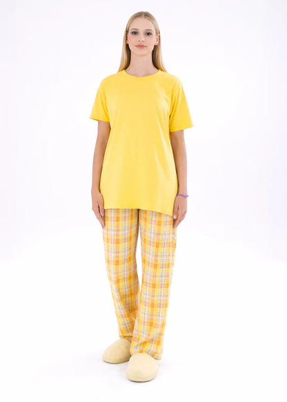 Yellow night shirt with crew neck and plaid pajama trousers, front view