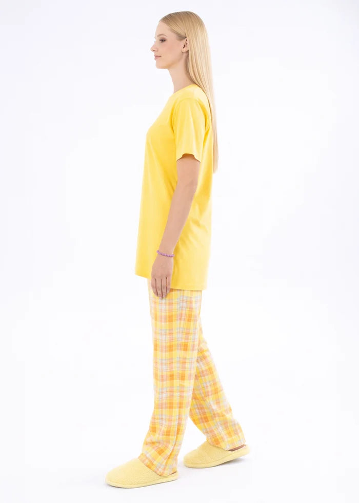 Yellow night shirt with short sleeves and plaid pajama trousers, side profile