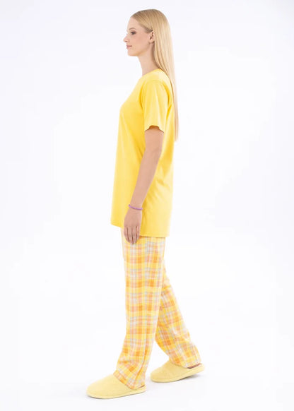Yellow night shirt with short sleeves and plaid pajama trousers, side profile