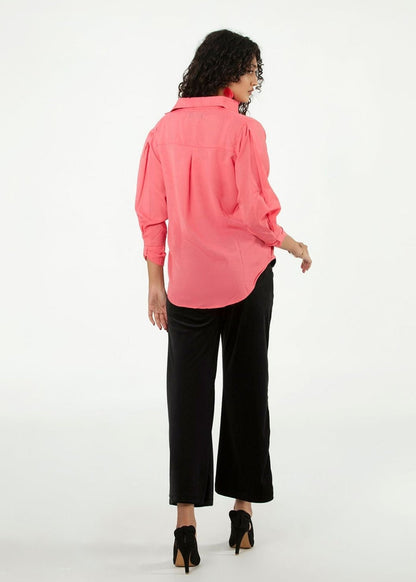 Women's pink button-up shirt, back view with gathered shoulders and long sleeves