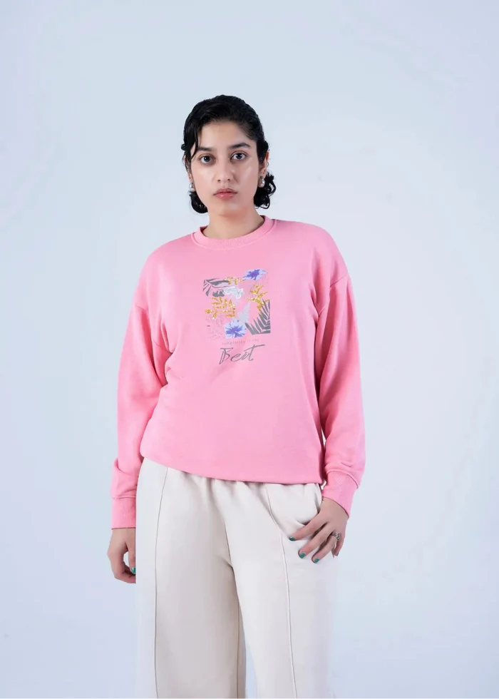 Women's pink crewneck knit sweatshirt with floral graphic logo, relaxed fit