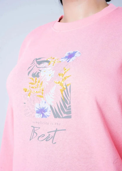 Pink crewneck knit sweatshirt with colorful floral graphic and 'Bet' script text