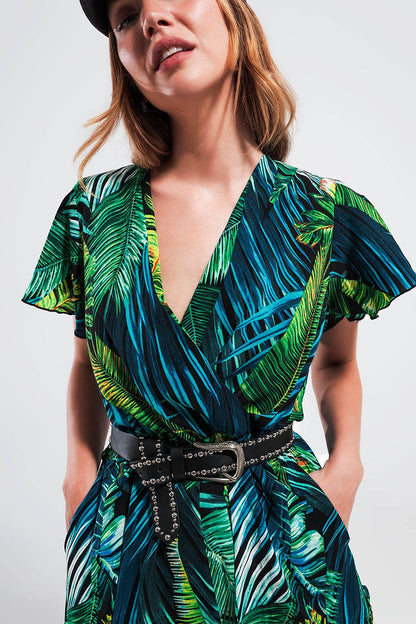 Wrap jumpsuit in green tropical print