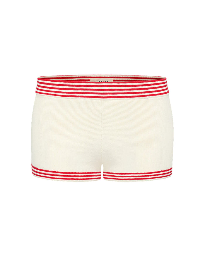 Off-model image of the LSPACE x The Salty Blonde Del Sol Short in cream-flame, a cream knit short with red striped trim at waist and hem.
