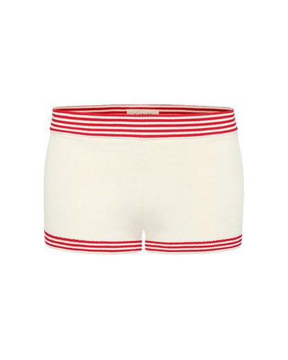 Off-model image of the LSPACE x The Salty Blonde Del Sol Short in cream-flame, a cream knit short with red striped trim at waist and hem.