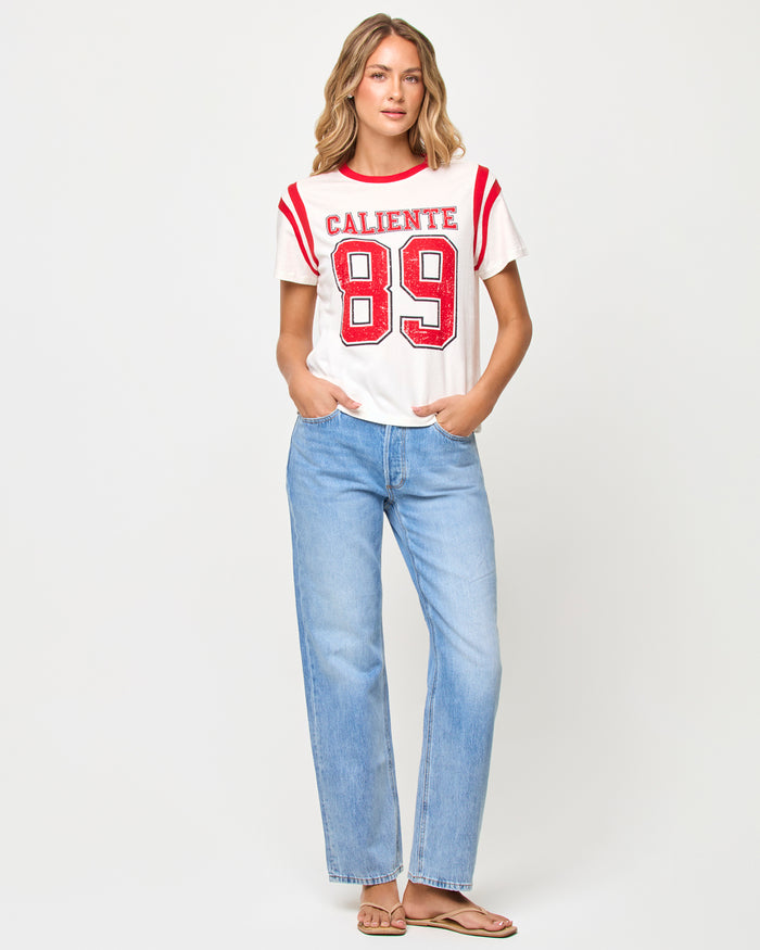 Front view of model wearing the LSPACE x The Salty Blonde Fresca Tee in caliente, a cropped graphic tee in a warm red tone.