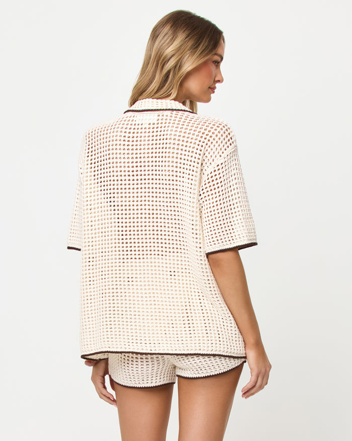Back view of model wearing the LSPACE x The Salty Blonde Scout Shirt in cream-espresso, an oversized button-front shirt.