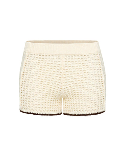 Off-model view of the LSPACE x The Salty Blonde Scout Short in cream-espresso, displayed flat to show the open-knit crochet texture, cream body, and espresso brown hem trim.