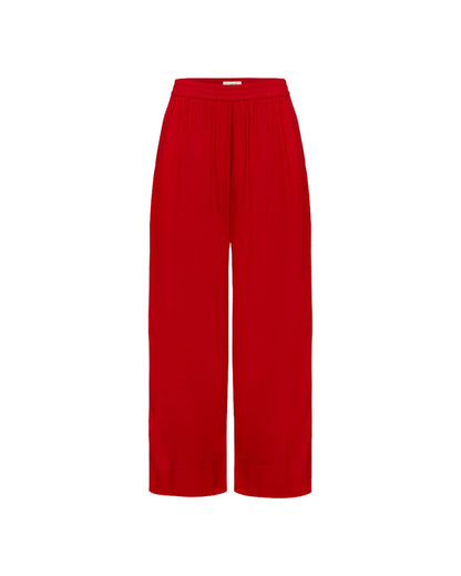 Off-model view of the LSPACE x The Salty Blonde Sur Pant in flame-cream, displayed flat to show the wide-leg silhouette and gathered waistband in flame red.