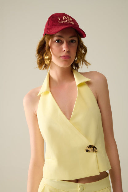 Yellow wrap vest with detailed gold button