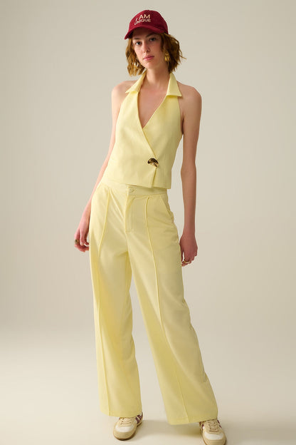 Yellow wrap vest with detailed gold button