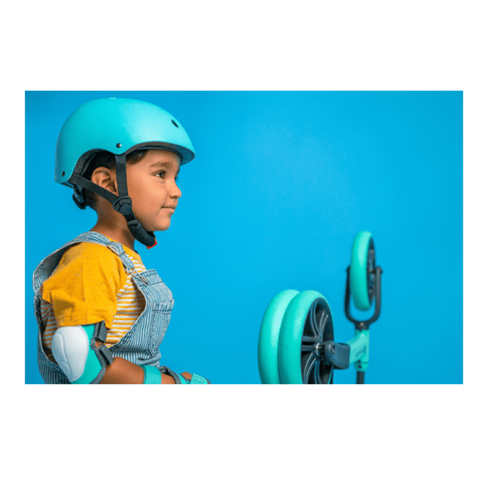 Green Yvolution kids wrist guards with adjustable velcro straps