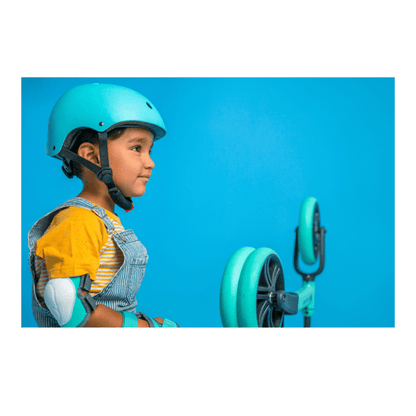 Green Yvolution kids wrist guards with adjustable velcro straps